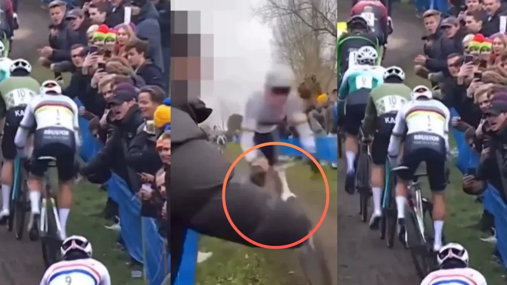 Intenta tirarle de la bicicleta en plena carrera golpeando su manillar.